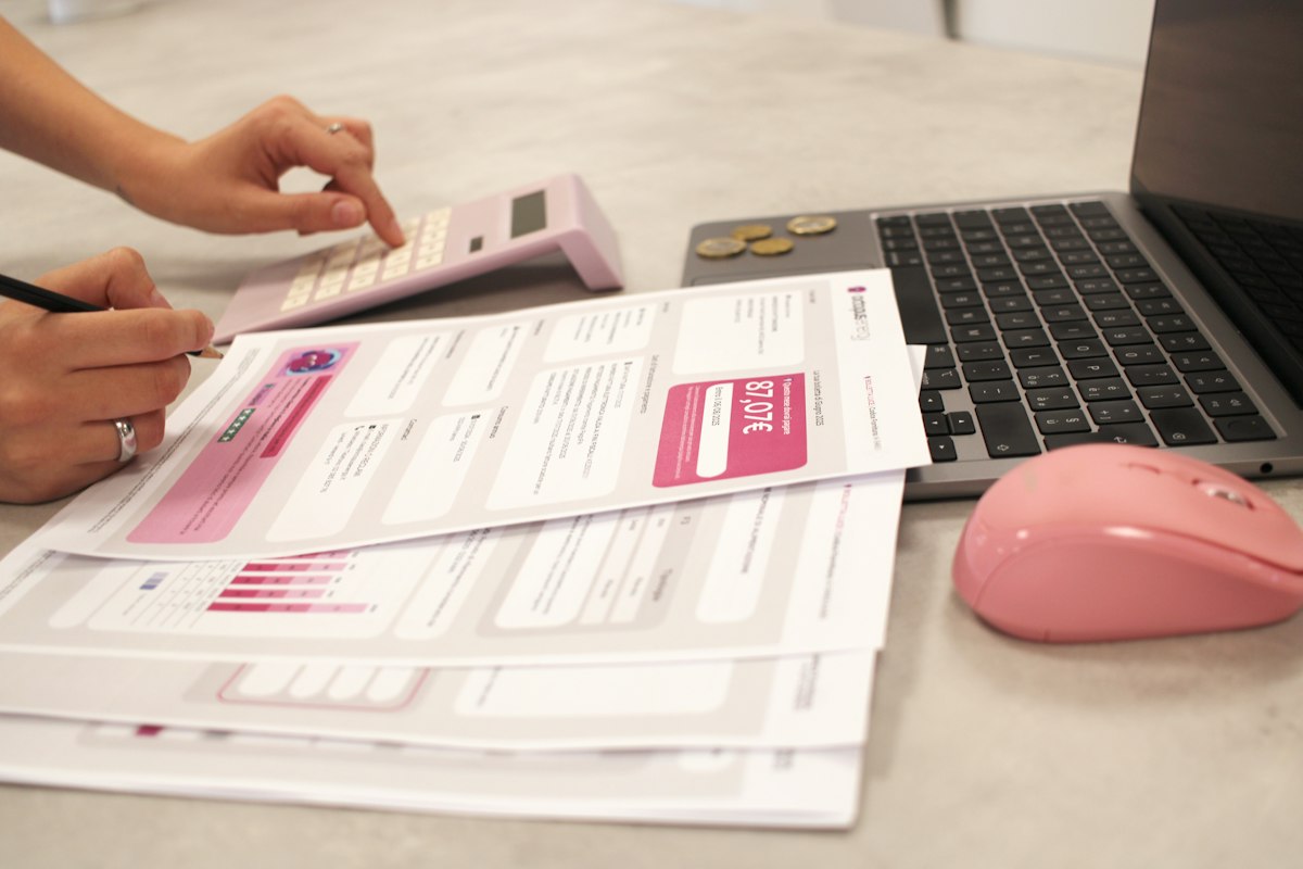 Invoices and billing paperwork on a desk with automated reminders