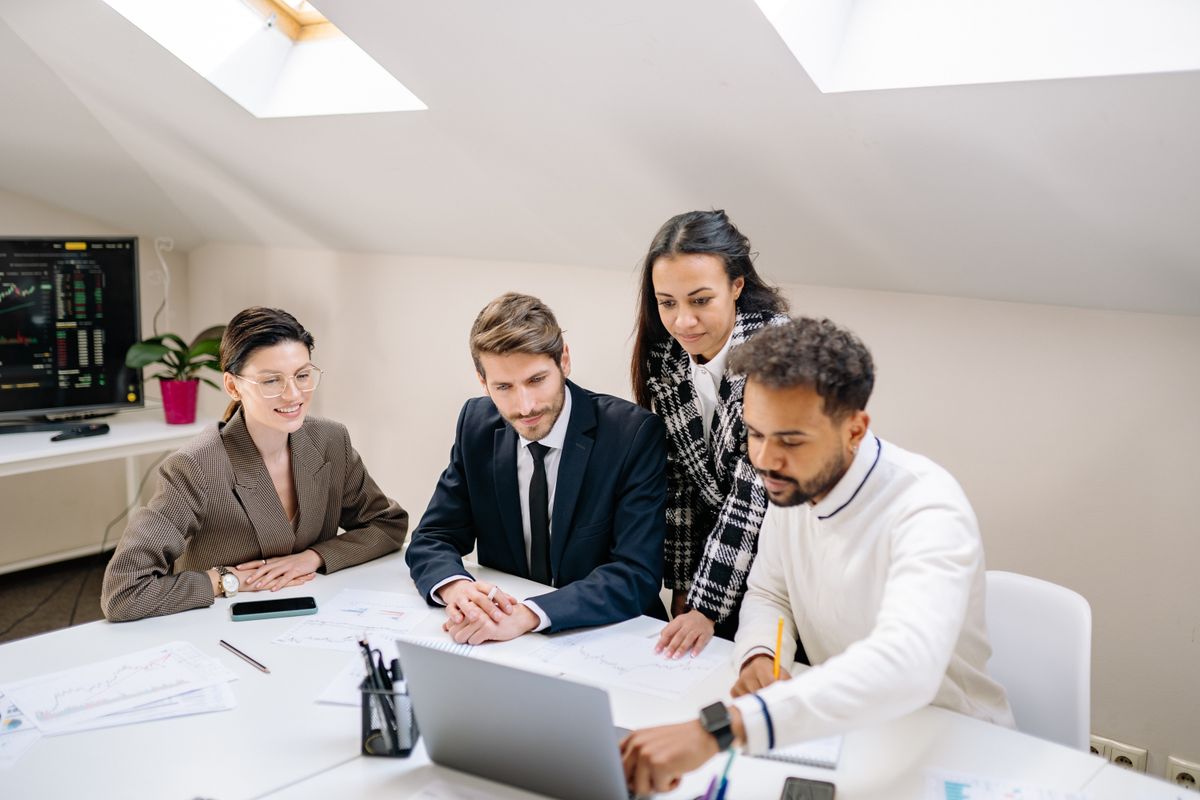 Diverse team collaborating on a project in a modern office setting