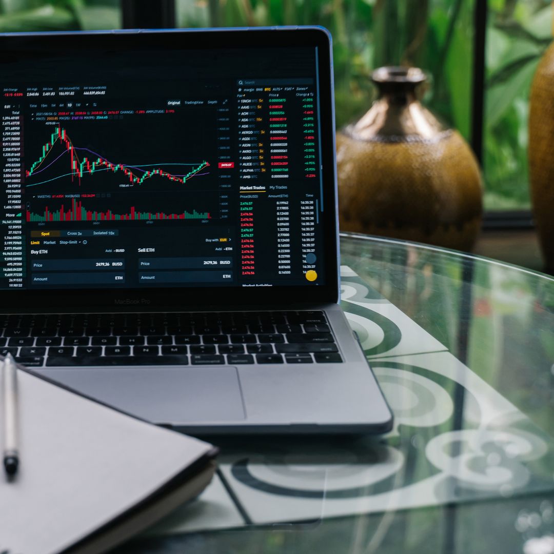 Cryptocurrency price chart displayed on a laptop screen