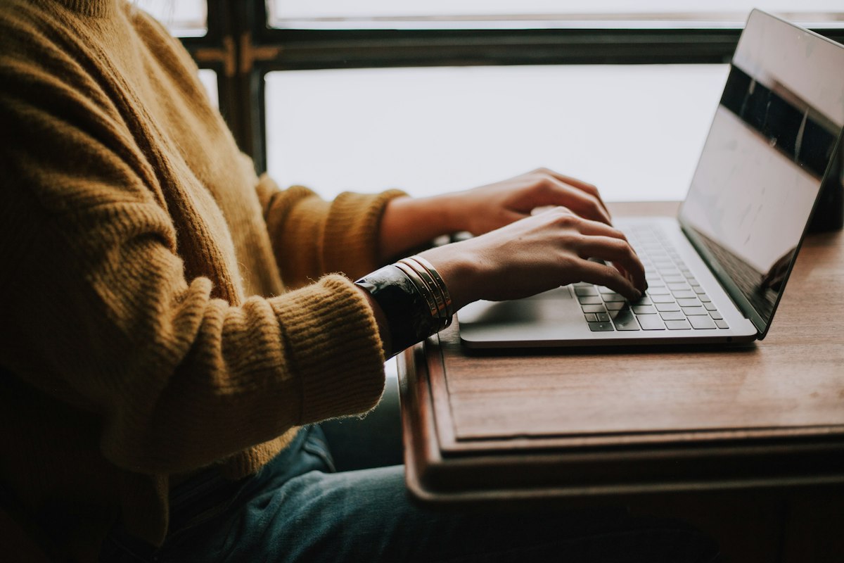 A person reviewing a website on a laptop, thinking aloud while recording screen and voice