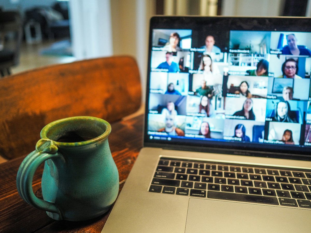 Professional on a video call from a home office setup