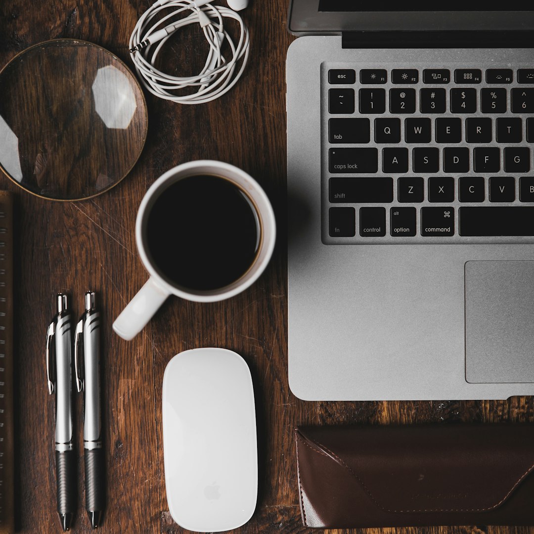 Laptop and coffee on a wooden desk, a calm remote work morning